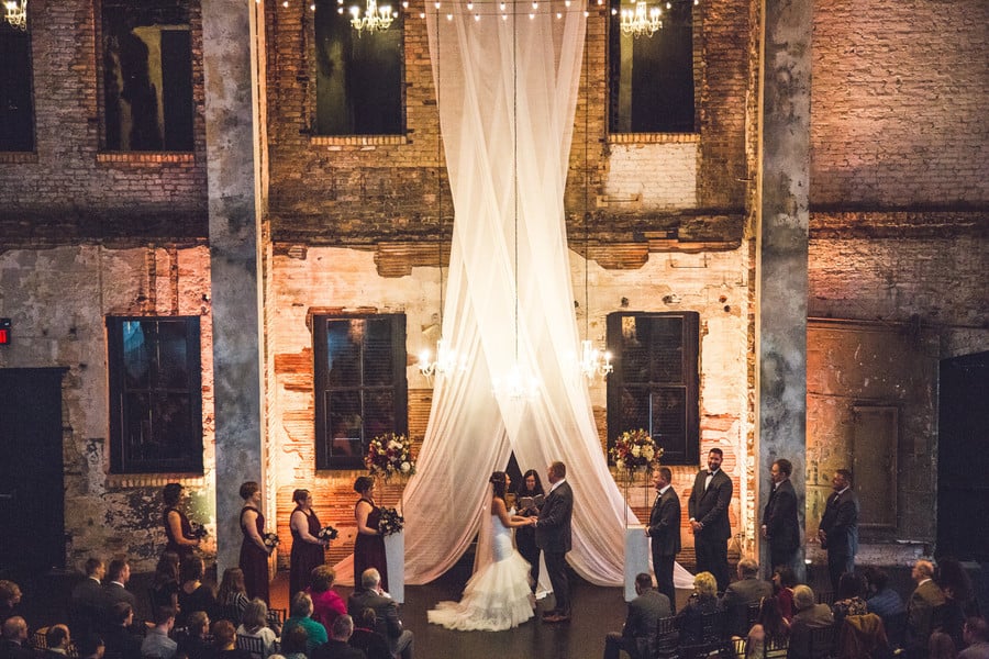 Fabric suspended from ceiling at wedding ceremony