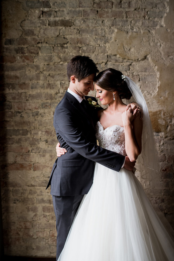 Bride and groom embrace