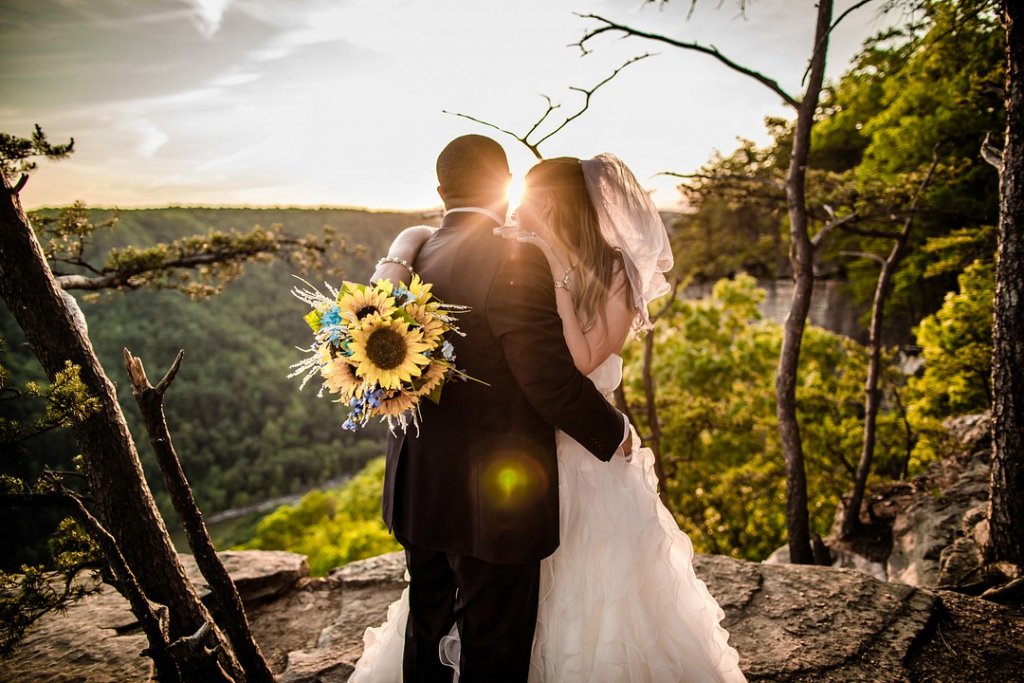 Bride and groom overlooking the mountains