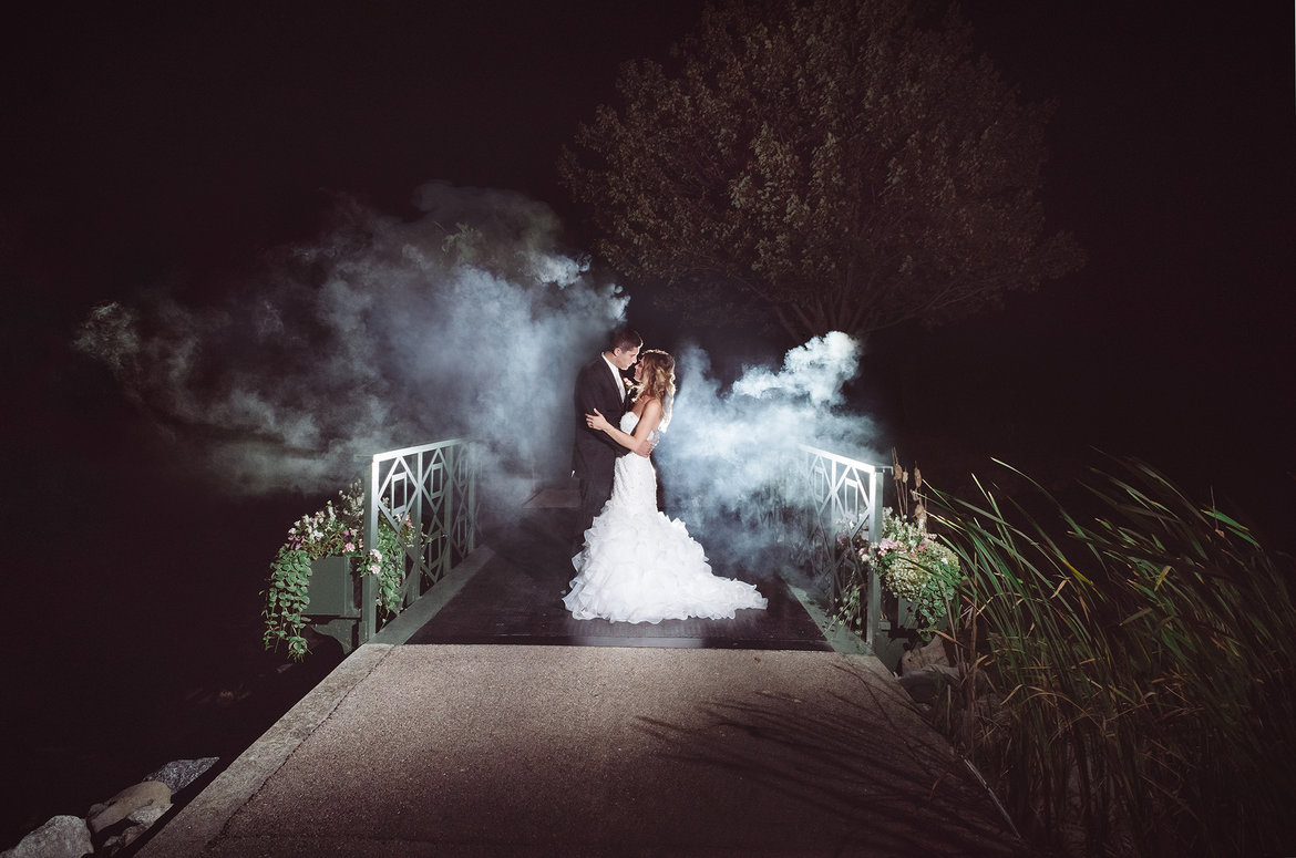 bride and groom with smoke background