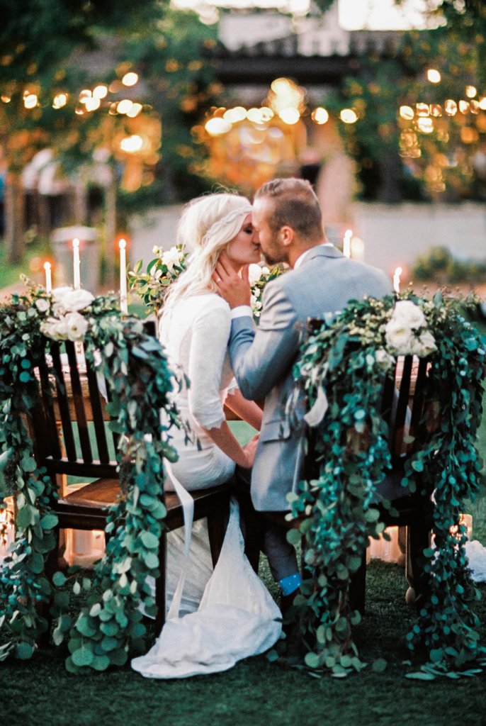 boho chic outdoor wedding bride and groom kiss