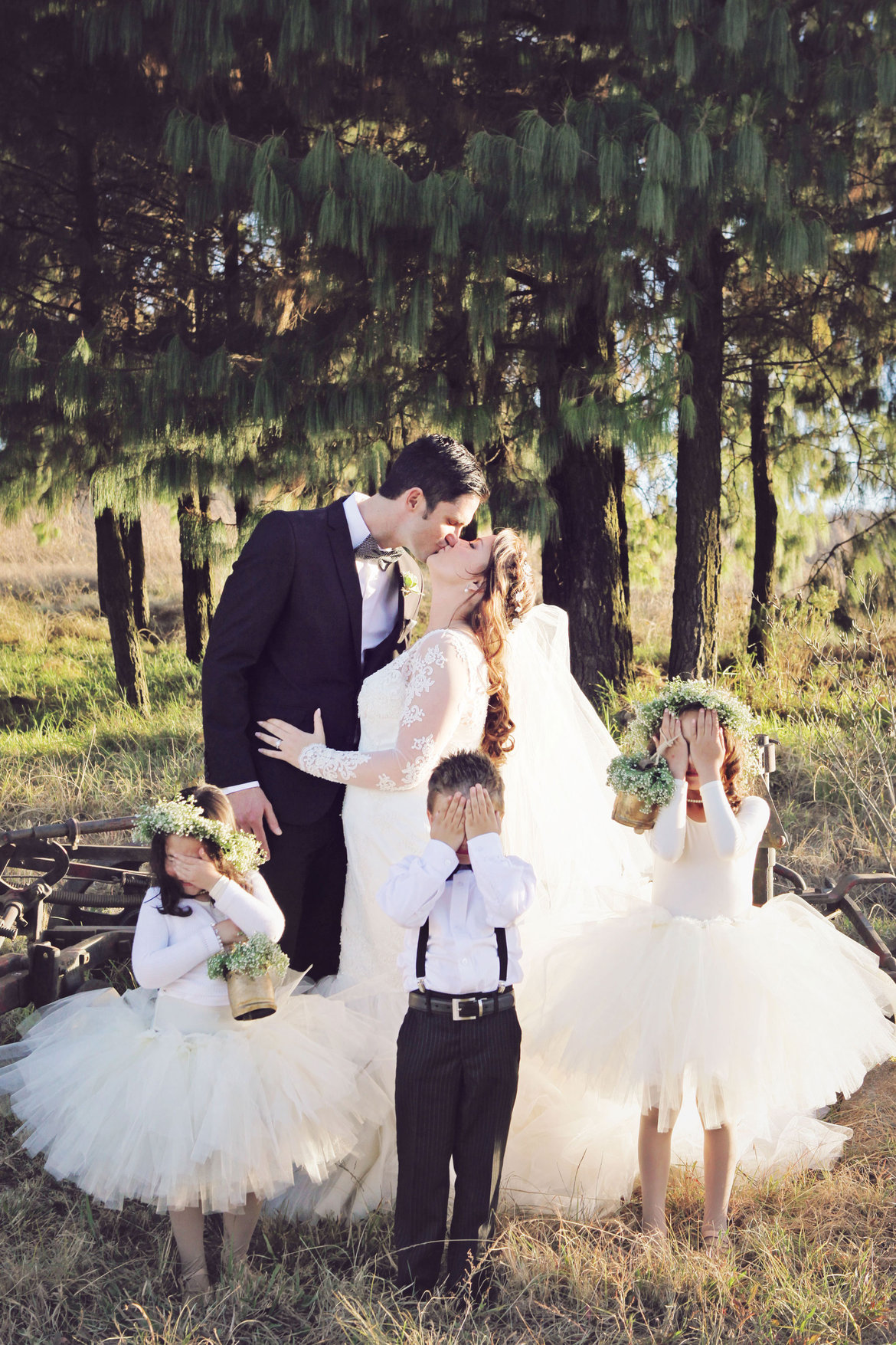 bride an groom with the flower girl and ring bearer 