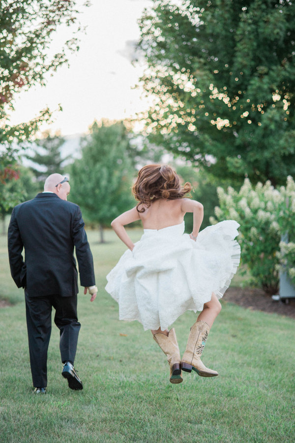 bride jumping for joy on wedding day