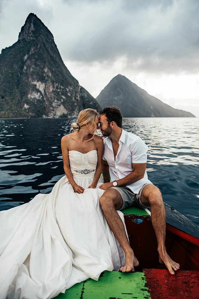 Bride and groom kissing on a boat