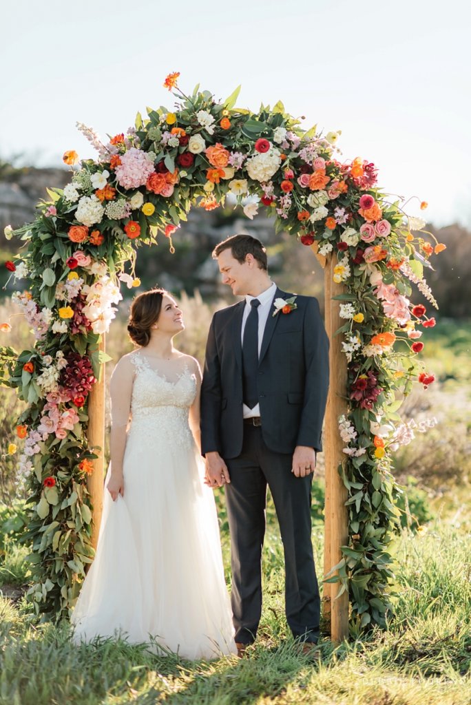 warm floral wedding arch