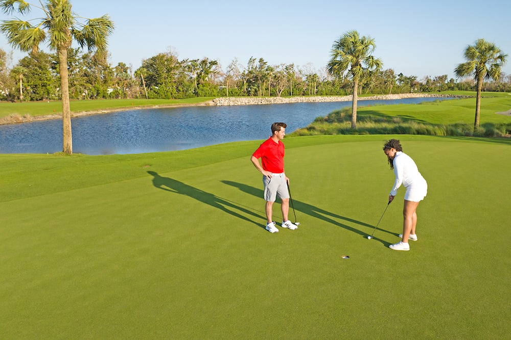 couple golfing