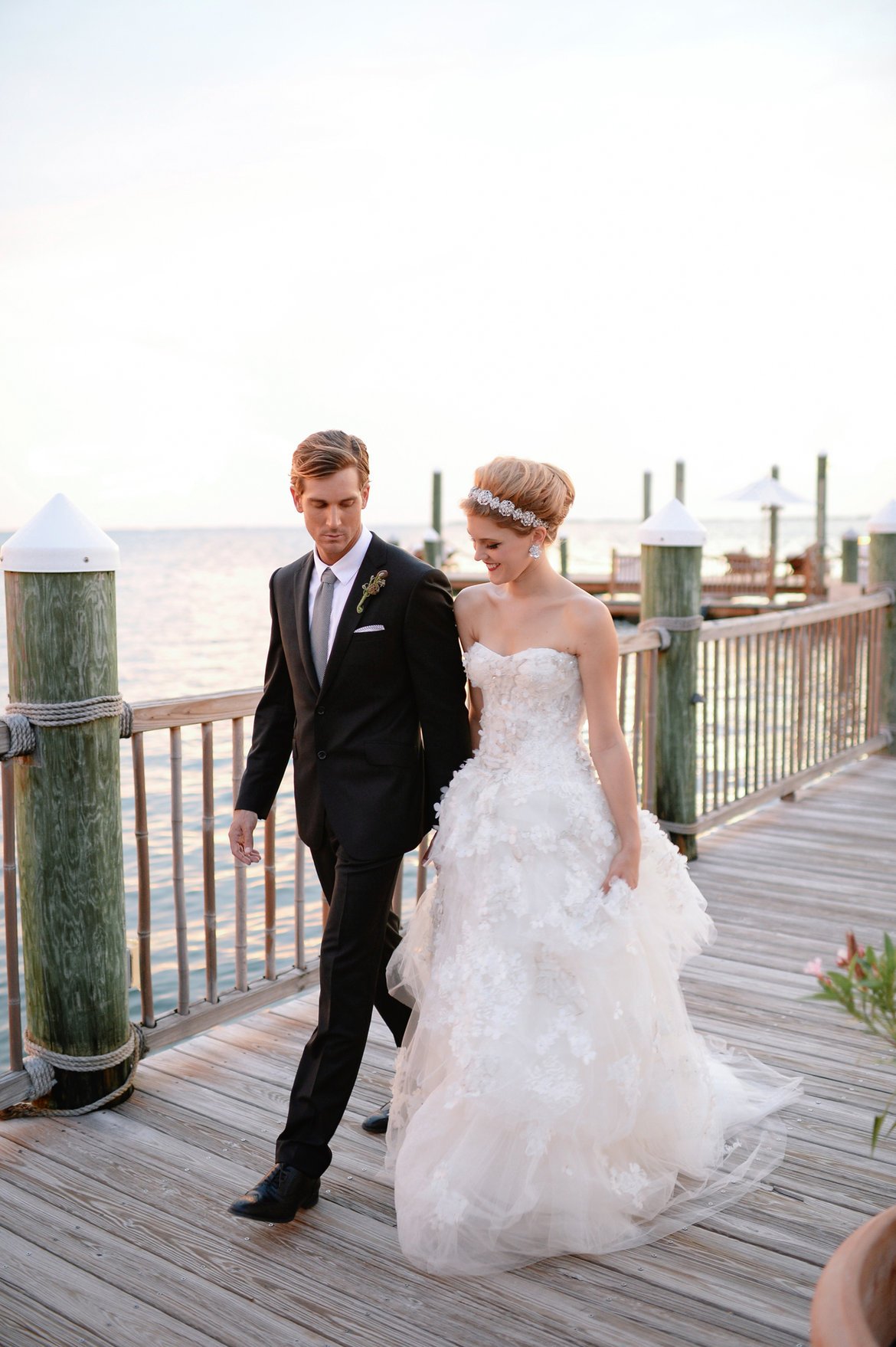 bride and groom on dock