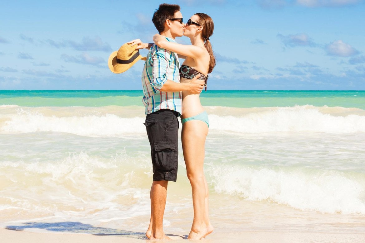 couple kissing on beach