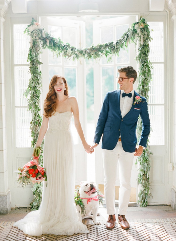 bride and groom smiling with dog