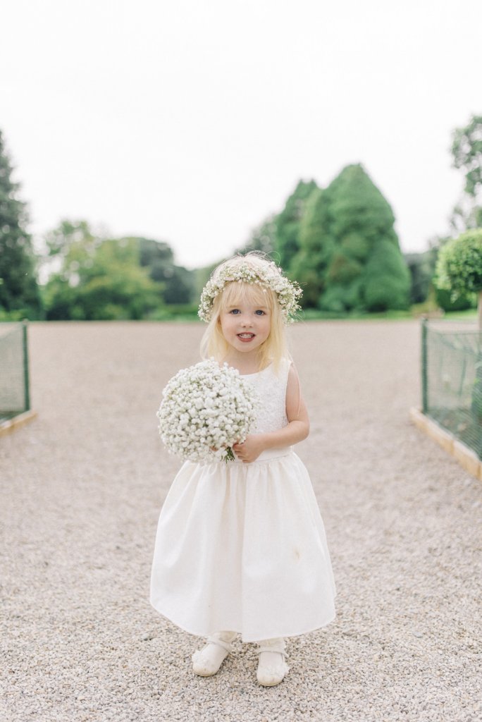 flower girl with baby's breath flower crown and bouquet