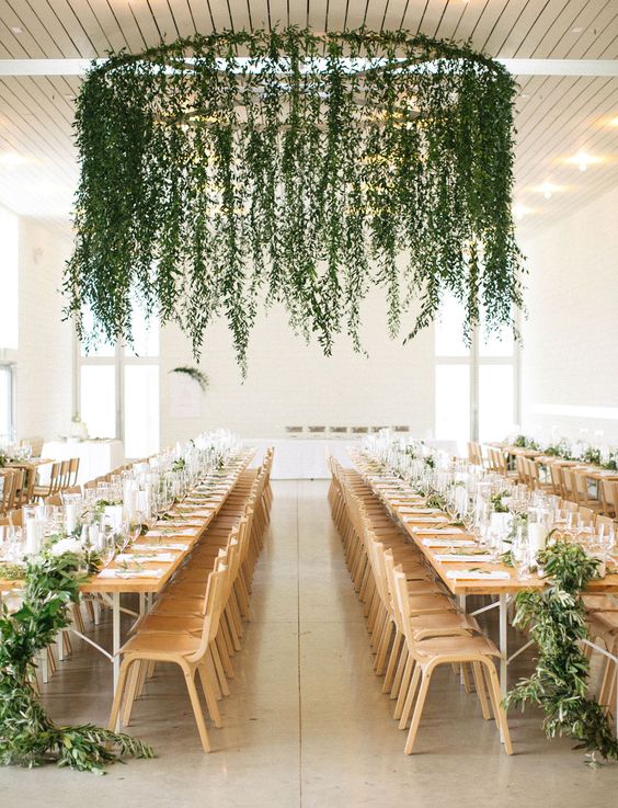 weather vane covered in greenery centerpiece