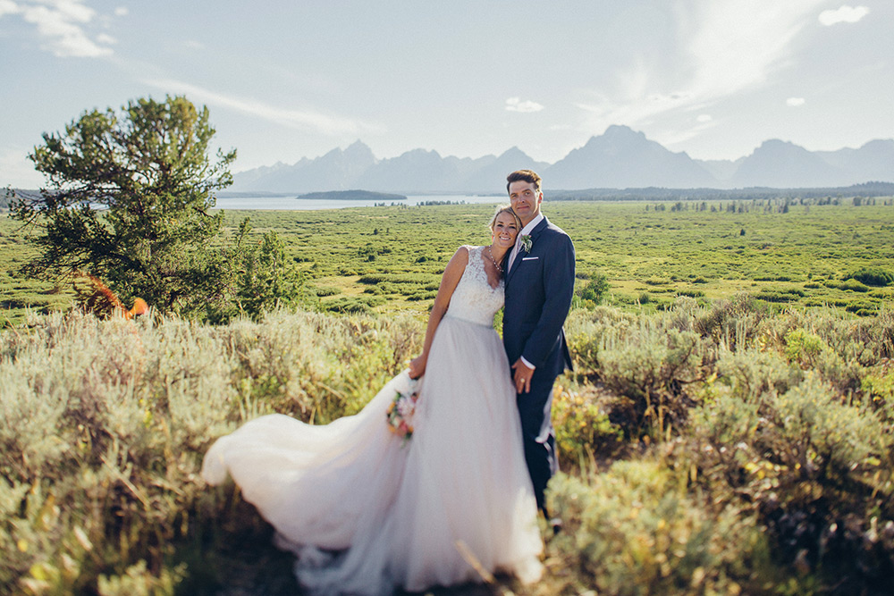 Bride and groom in a field