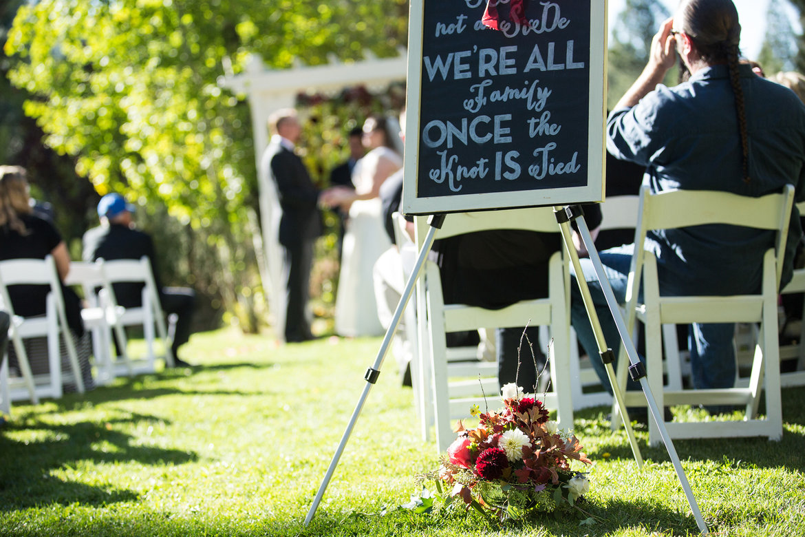 family sign at wedding