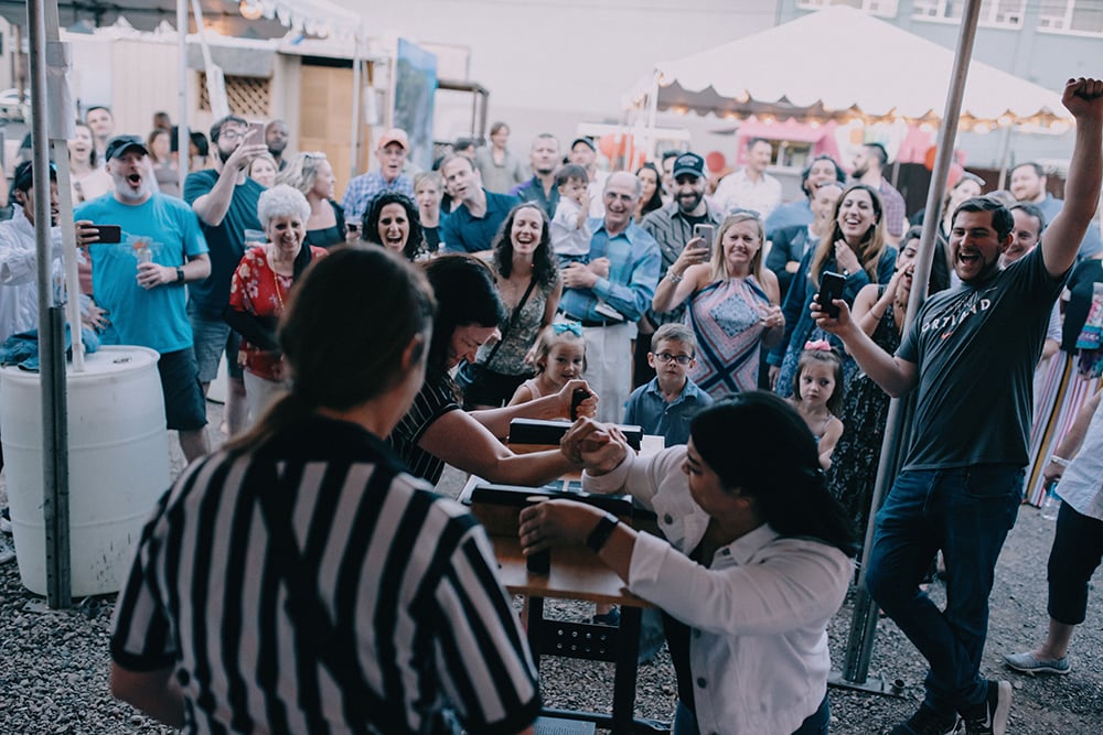 arm wrestling competition at wedding