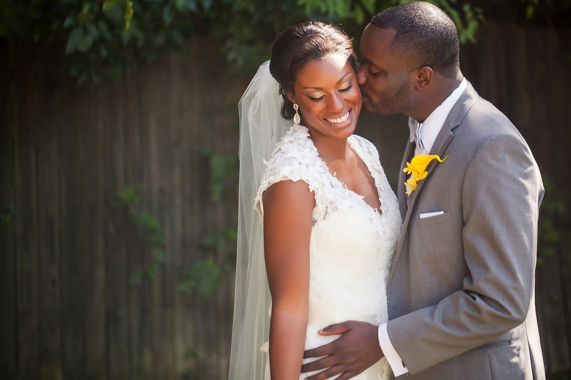 bride groom kissing