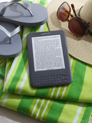 kindle on beach towel