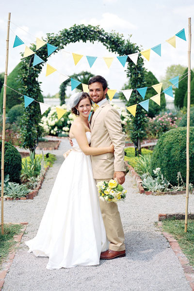 bride and groom with banner 