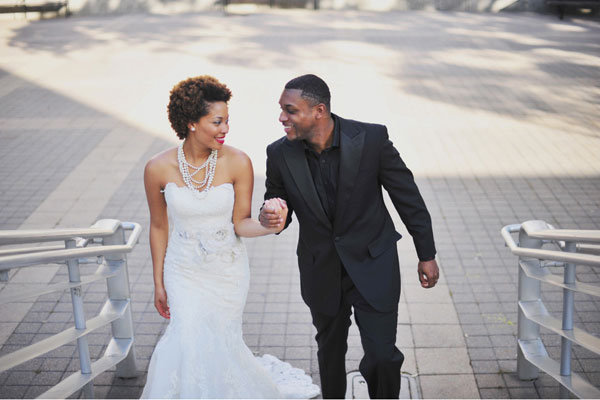 bride and groom holding hands