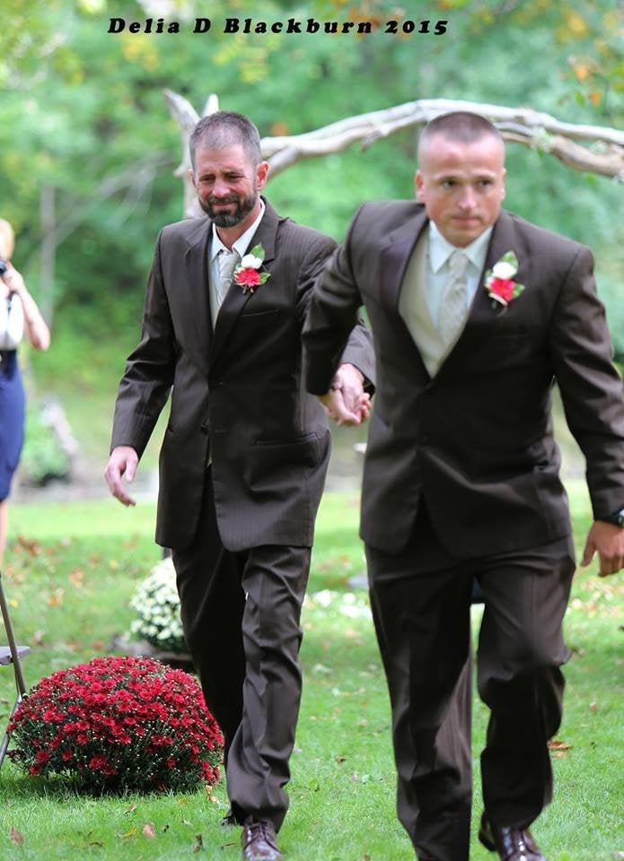 brides father and stepfather walk down the aisle