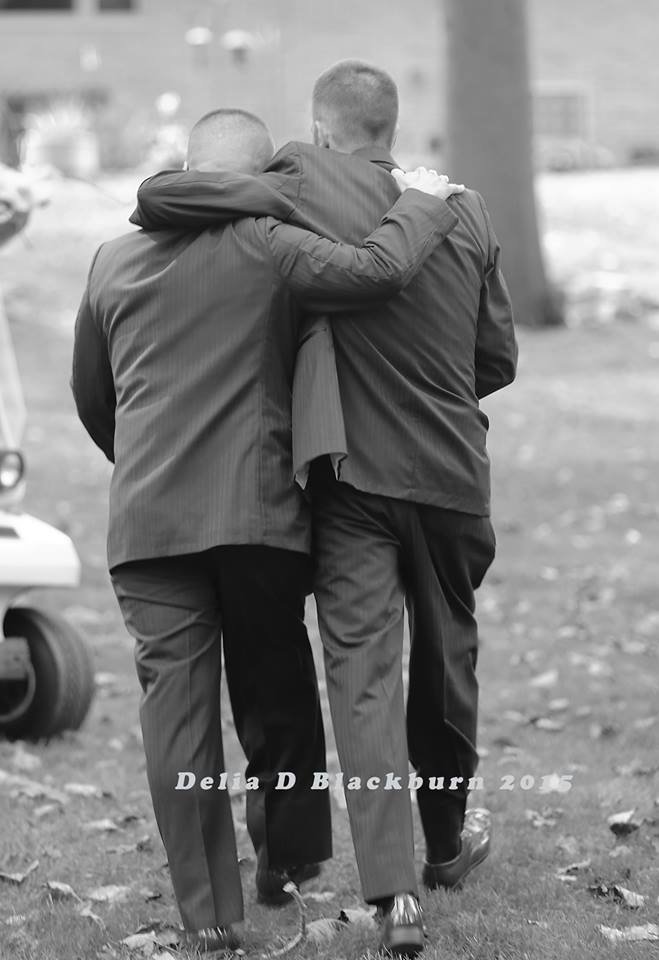 brides father and stepfather walk down the aisle