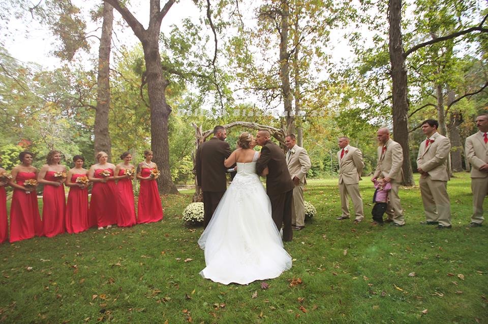 brides father and stepfather walk down the aisle