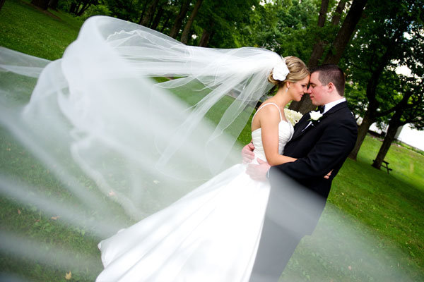 bride and groom through the wedding veil