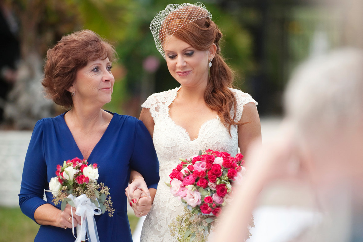 mom walking bride down the aisle