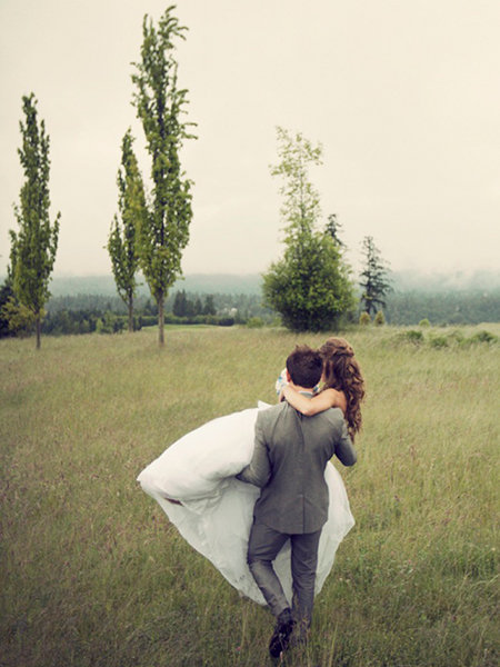 groom carrying bride