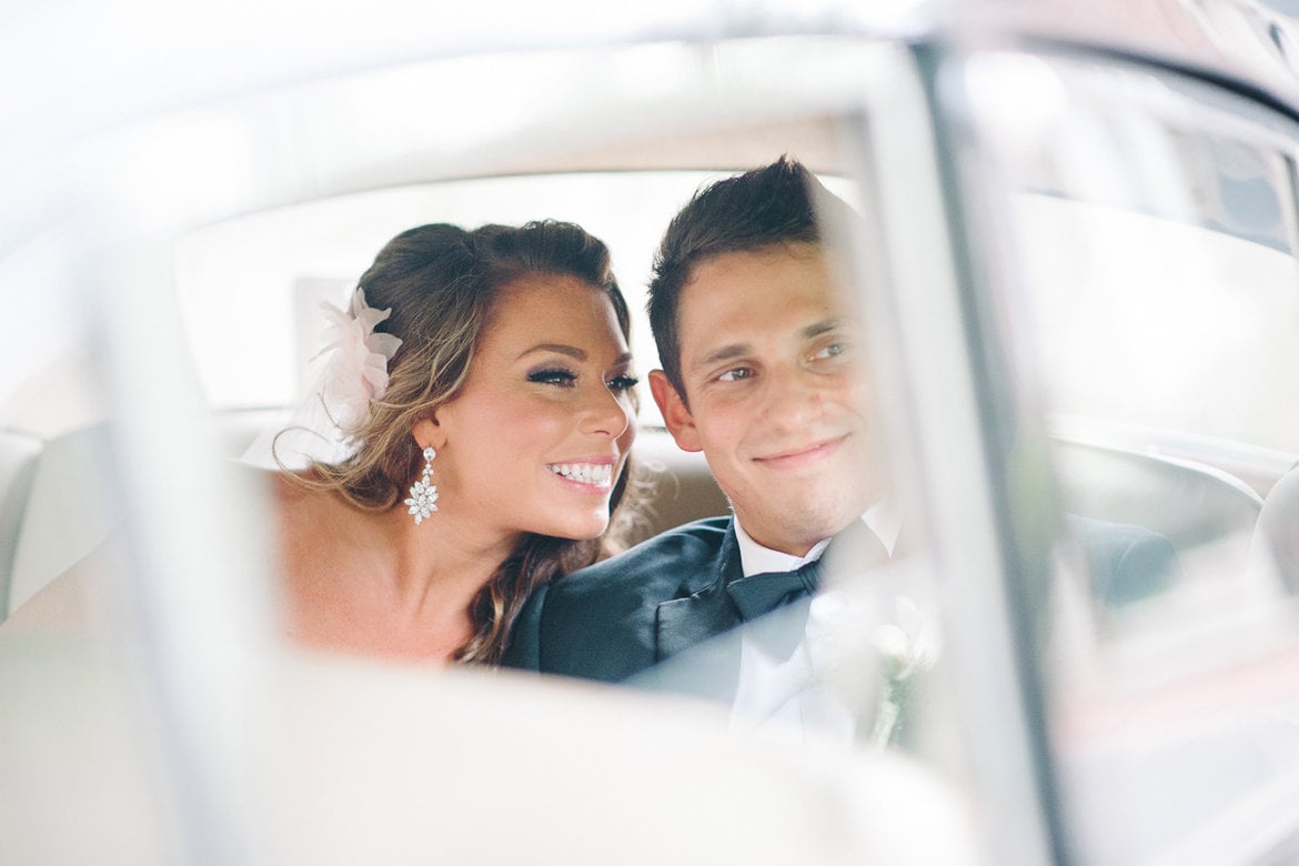 bride and groom in limo